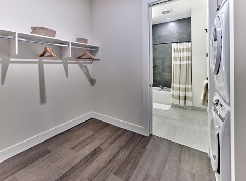 large walk-in closets with built-ins, hardwood flooring throughout, tiled bathrooms