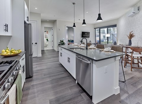a large kitchen with an island in the middle of it