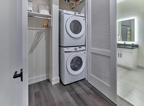 a front loading washer and dryer in a laundry room