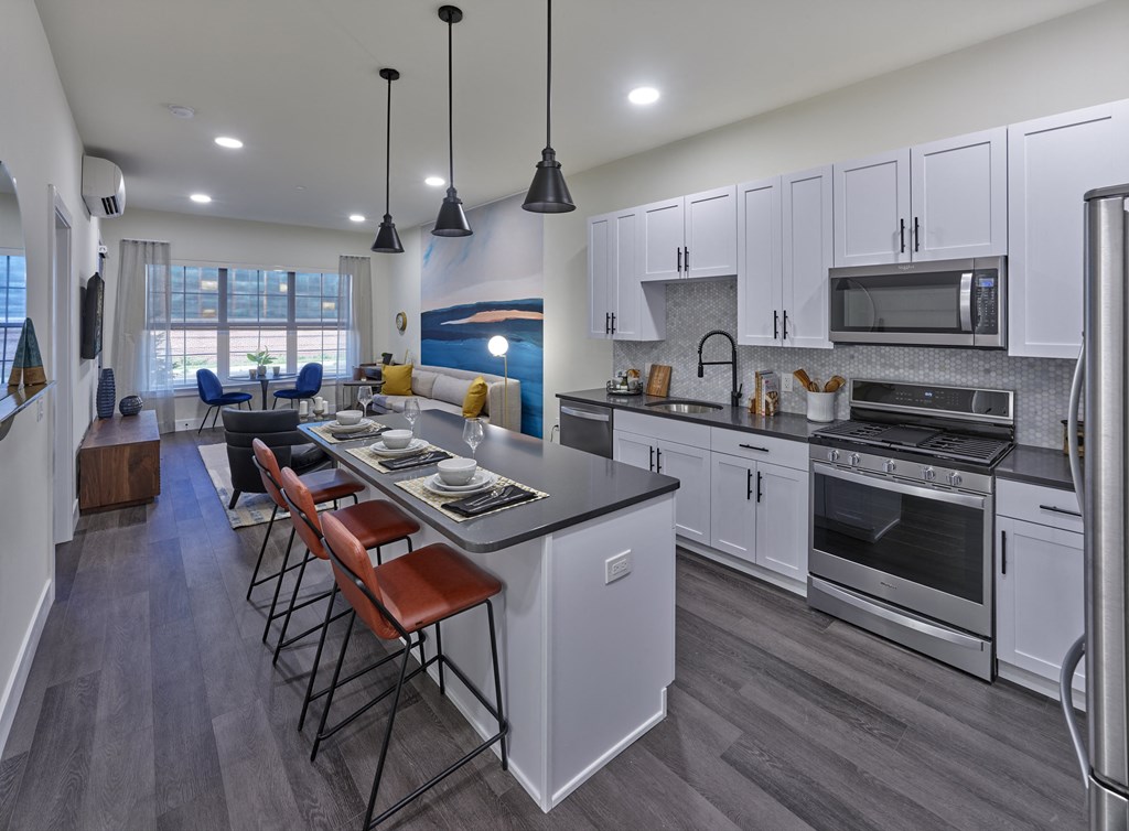 large one bedroom home, private balcony, open living space, large kitchen, stainless steel appliances