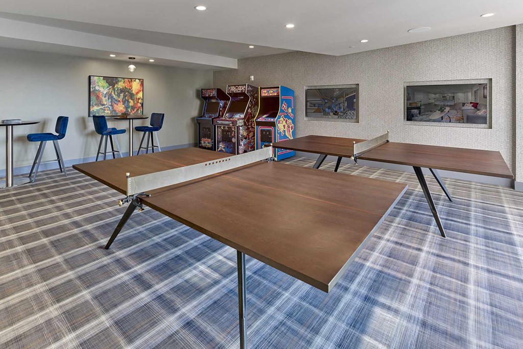 A conference room with a long table and chairs.