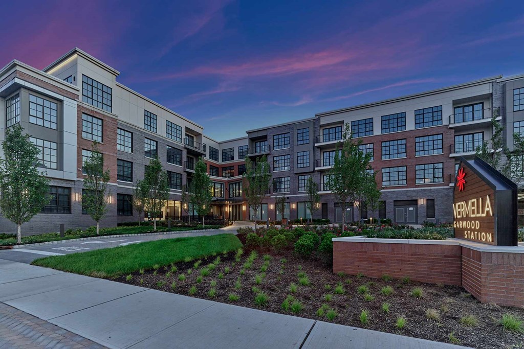 A modern apartment complex named Vermella Cedarwood Station is shown.