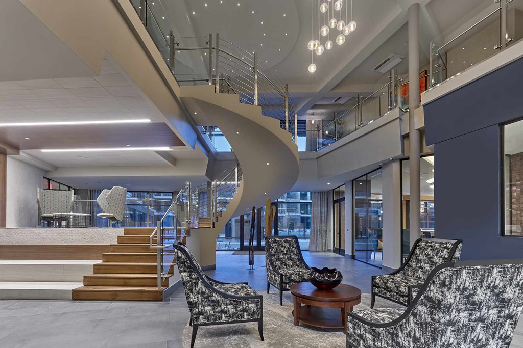 A modern living room with a spiral staircase.