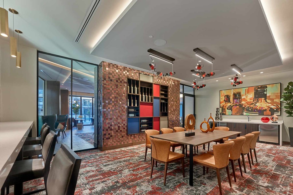 A conference room with a long table and chairs.