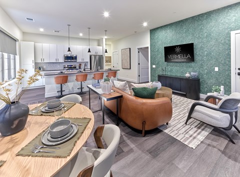 Residences A modern dining room with a wooden table set for two.