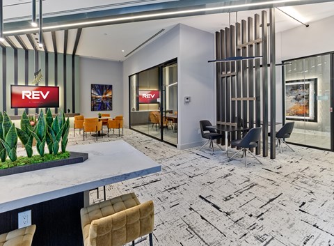 A modern office space with a reception area and meeting rooms.