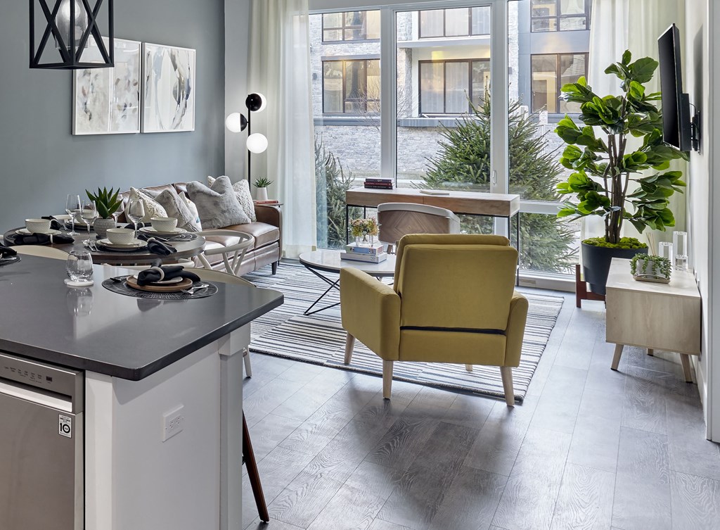 Living Room with floor to ceiling windows and landscaped view