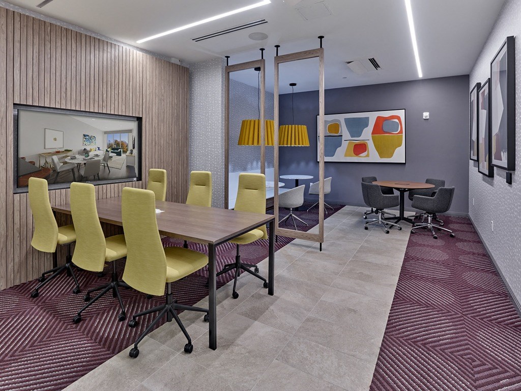 a conference room with a table and chairs