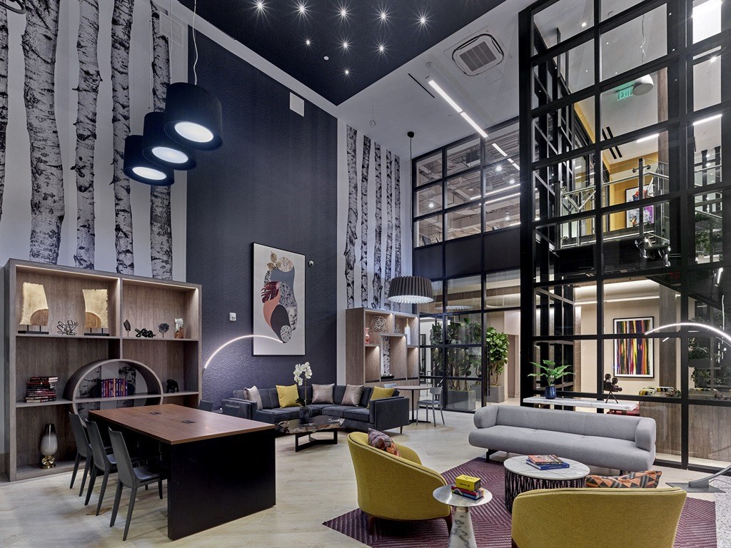 a living room with couches and chairs and a table