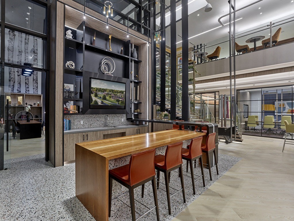 a dining area with a wooden table and chairs and a television