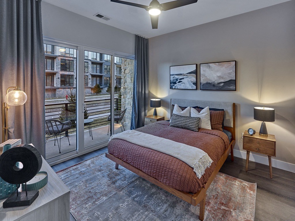 a bedroom with a bed and a balcony