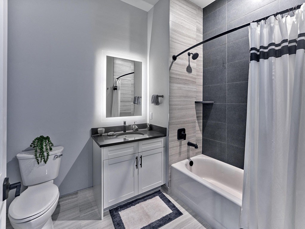 a bathroom with a sink toilet and a shower