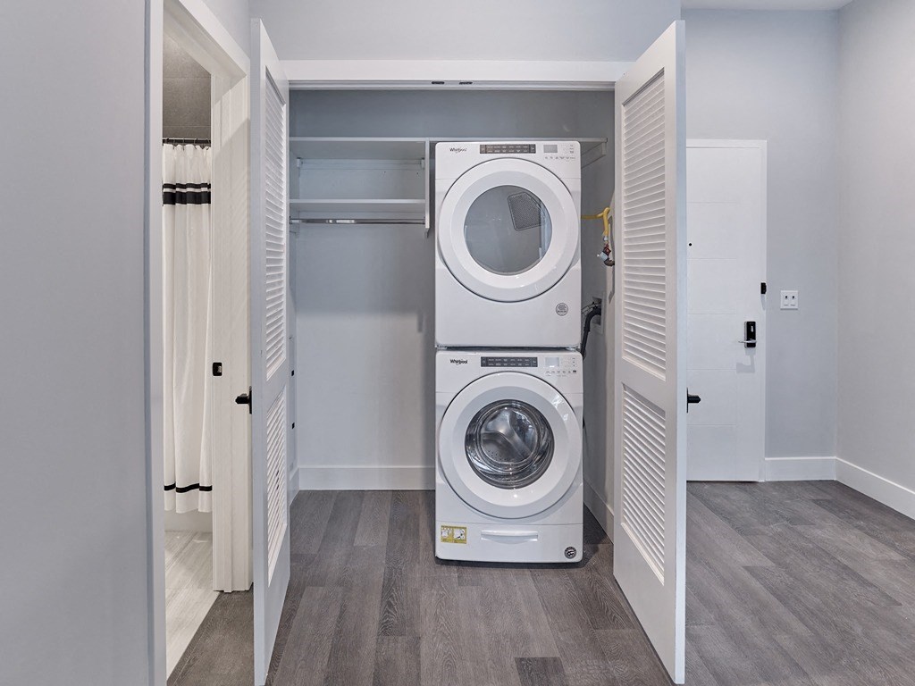 a front loading washer and dryer in a laundry room
