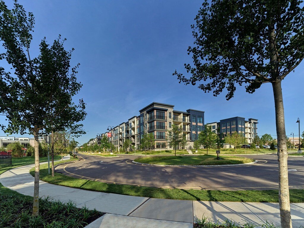 a view of a city street with trees and buildings