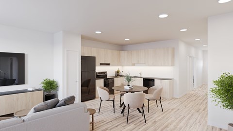 A modern living room with a grey sofa, a black television, and a dining table with chairs.