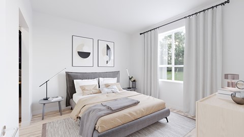 A bedroom with a large bed and two framed pictures on the wall.