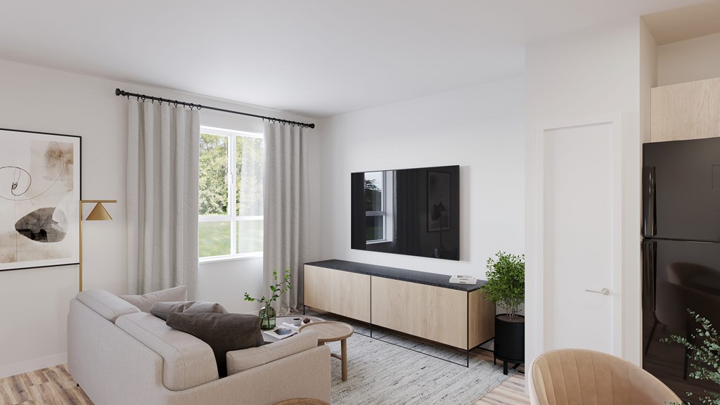 A modern living room with a grey sofa and a wooden cabinet.