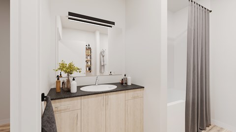 A bathroom with a sink, mirror, and a grey shower curtain.