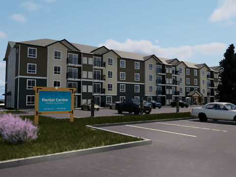A large apartment building with parking in front