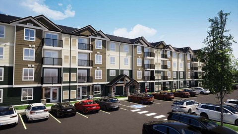A row of apartment buildings with cars parked in front.