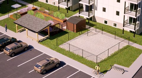 A pergola, community garden and dog run sit in a small green space between apartments and a parking lot