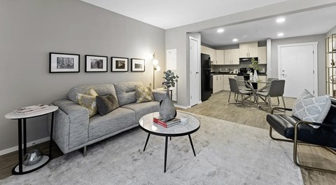 a large open living room that is open to the kitchen