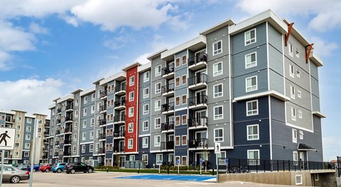 A large apartment complex with lots of parking