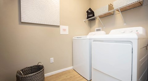 A laundry room with a washer and dryer.