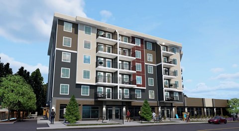 Large modern apartment building with commercial space on the ground floor