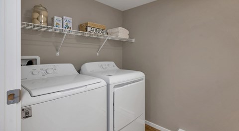 A laundry room with washer and dryer