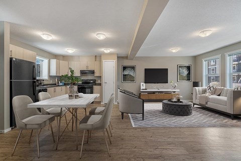 A modern kitchen with a dining table and chairs.