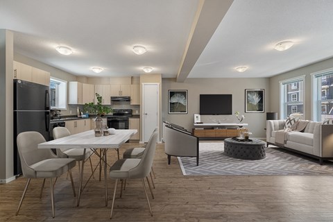 A modern kitchen with a dining table and chairs.