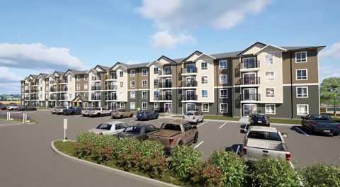 A large apartment building with parking out front