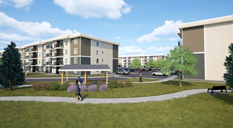 An apartment complex with multiple buildings with parking