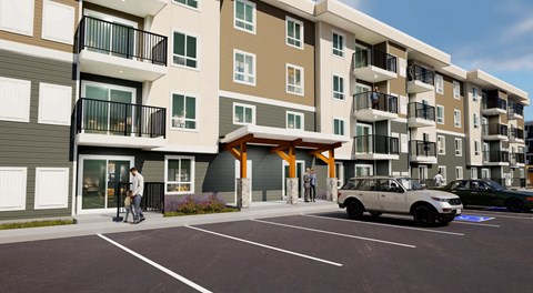 An apartment building with parking in front, balconies and lots of windows