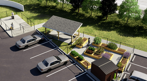 A parking lot with a community garden, pergola and dog run on one side