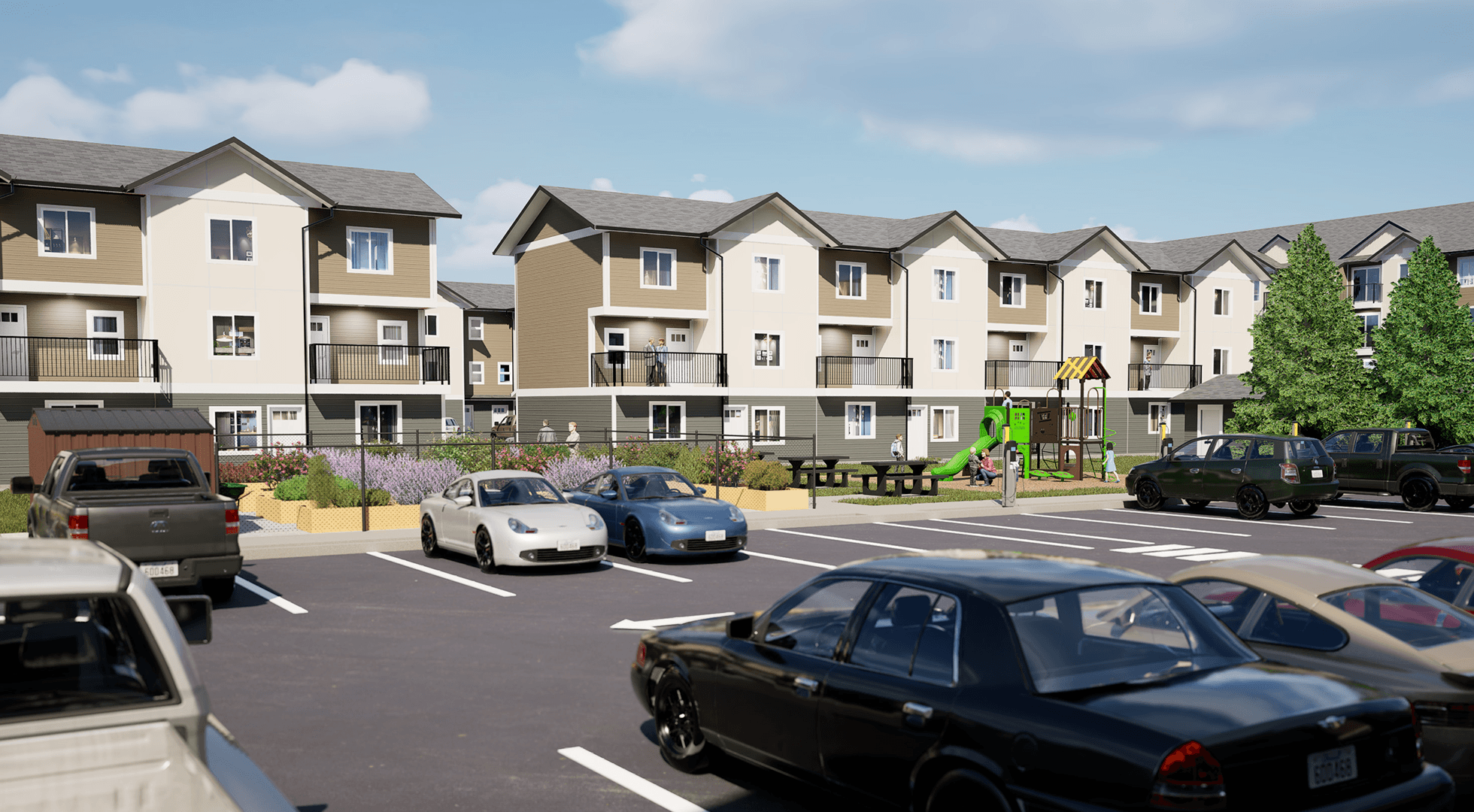 A larg complex with townhomes, parking, community garden and playground