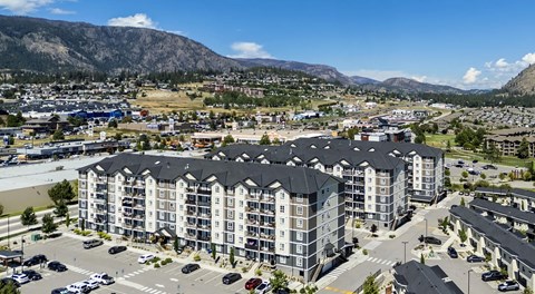 A large apartment complex with parking around all buildings