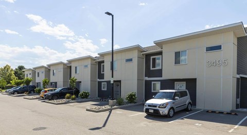 A row of houses with the number 3495 on the front of the first one.