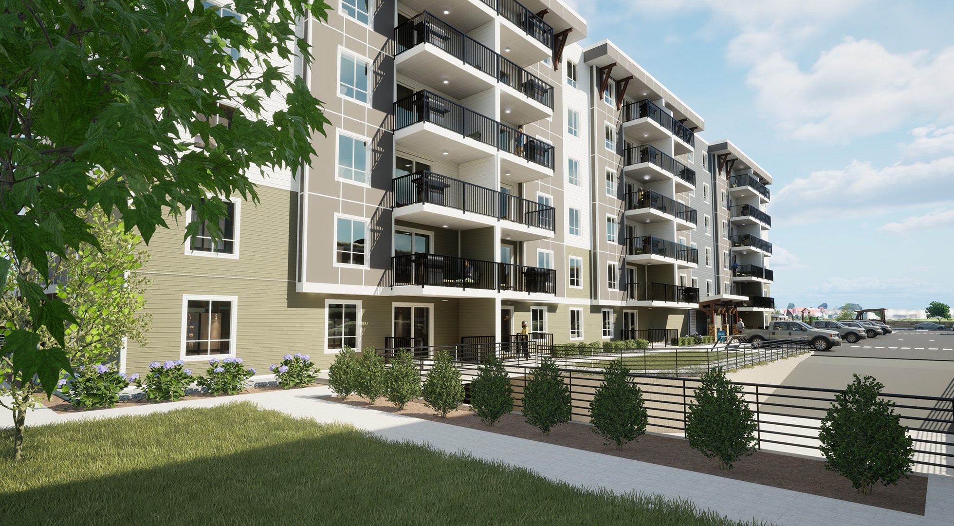 A modern apartment building with balconies and a landscaped front yard.