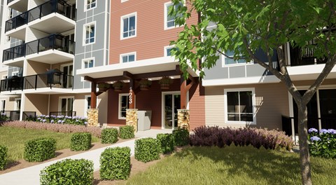 A modern apartment building with a landscaped front yard.