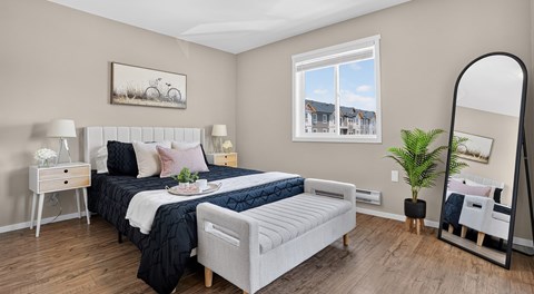 A bedroom with two beds, a dresser, and a mirror.