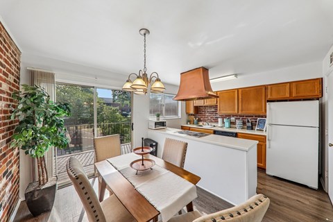 A dining room with a table and chairs is shown.