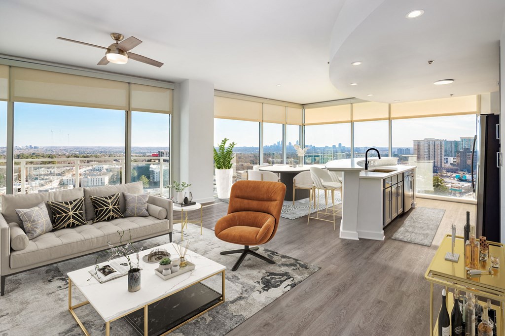 an open living room and kitchen with a view of the city