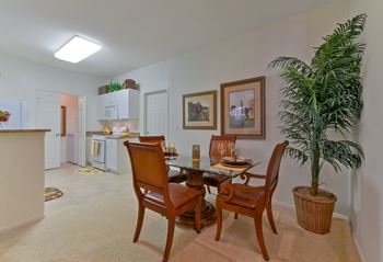 Breakfast Bar with a table and chairs  in a kitchen