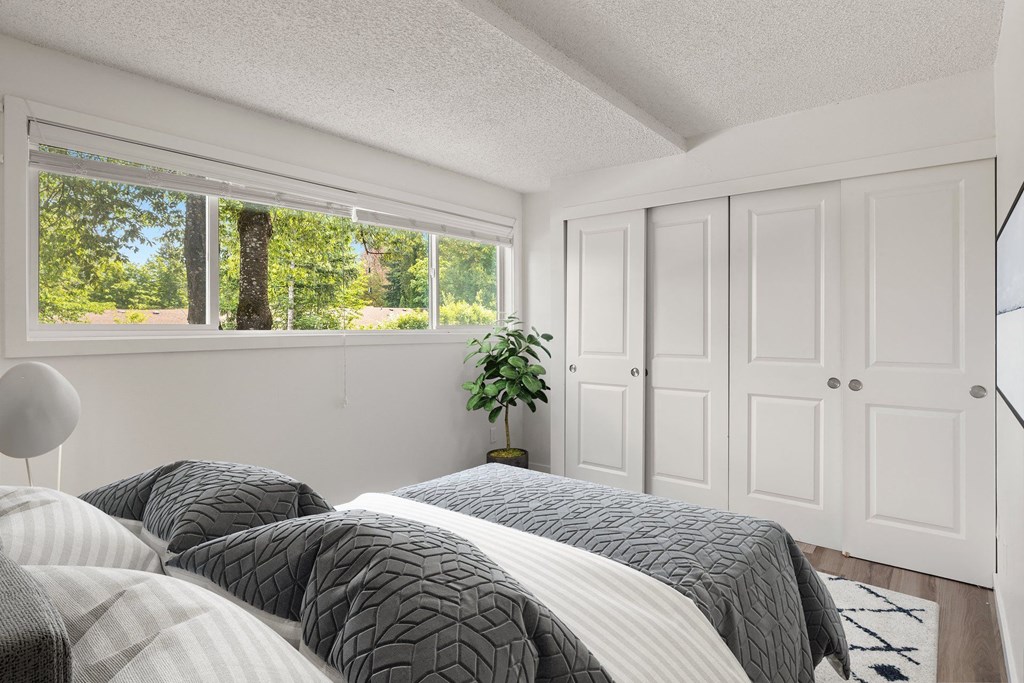 a bedroom with two beds and a window at Larkspur West Linn, West Linn, OR, 97068