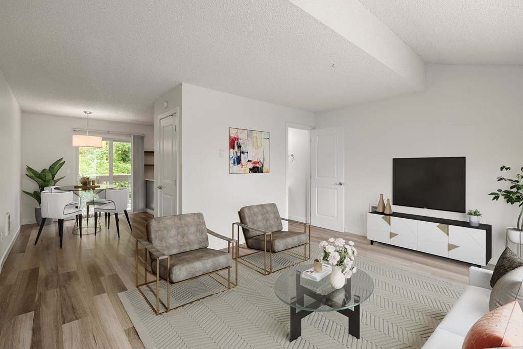 a living room with two chairs and a table  at Larkspur West Linn, West Linn