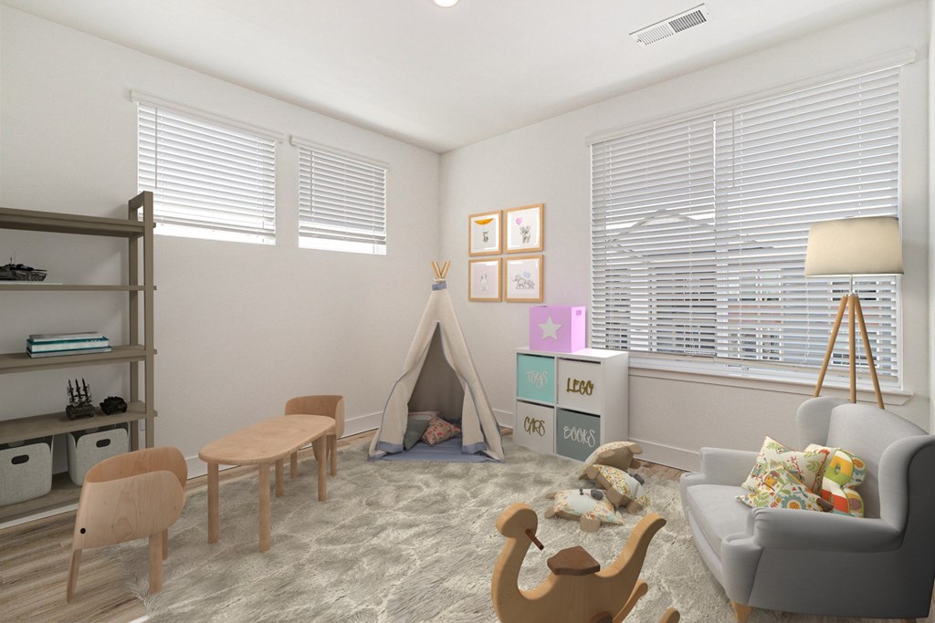 A child's room with a teepee, a couch, a table, and a wooden rocking chair.