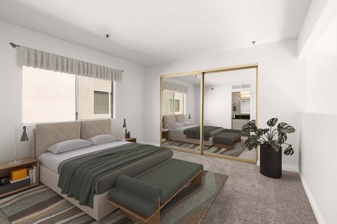 A bedroom with a large bed and a mirror on the wall.