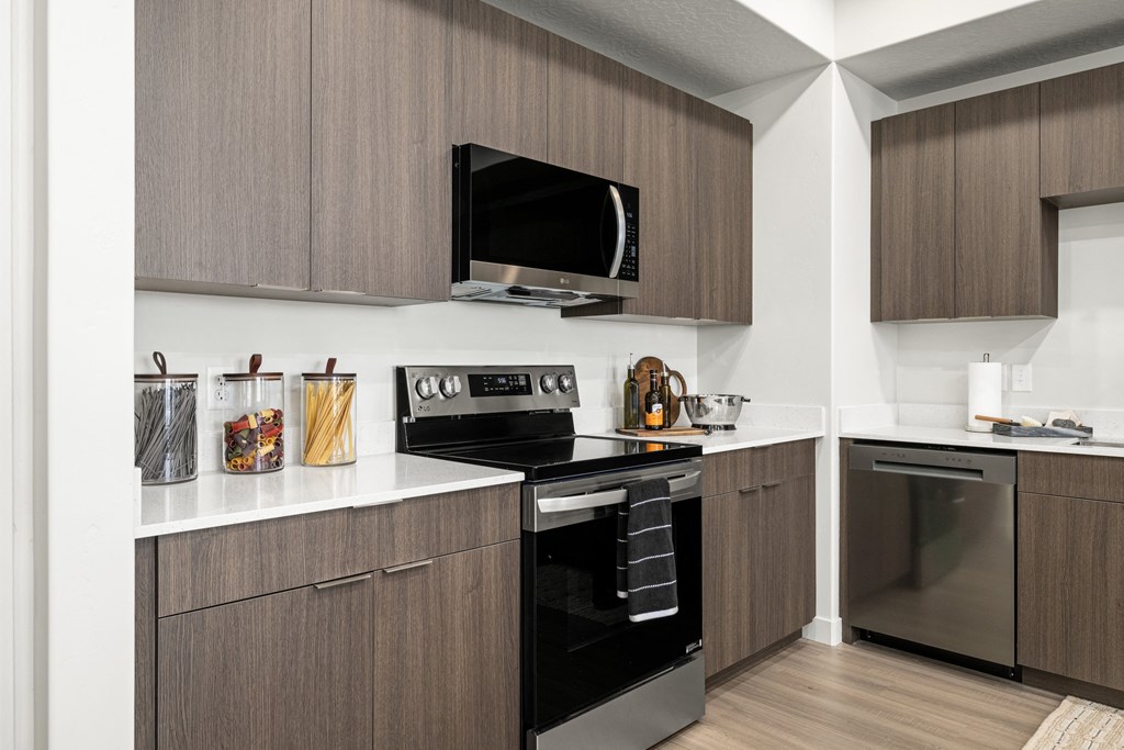 a kitchen with a stove and a microwave